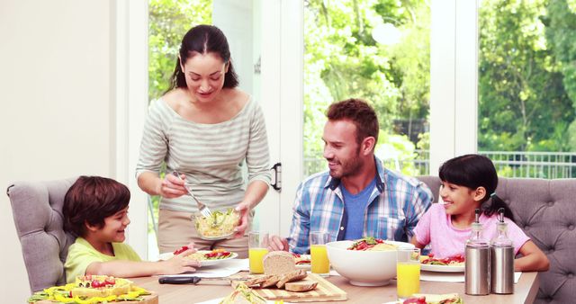 Happy Family Enjoying Healthy Meal Together - Download Free Stock Images Pikwizard.com