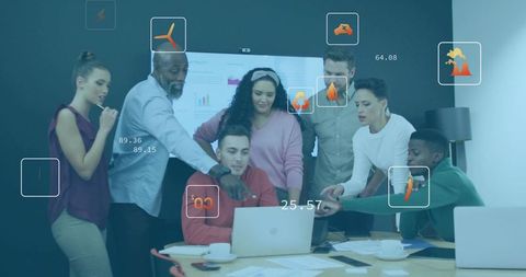 Collaborating team gathered around laptop with augmented data overlays and analytics