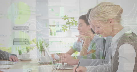 Diverse Business Team Analyzing Data with Futuristic Holographics