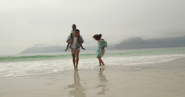 Family Enjoying Sunny Day on Beach - Download Free Stock Images Pikwizard.com