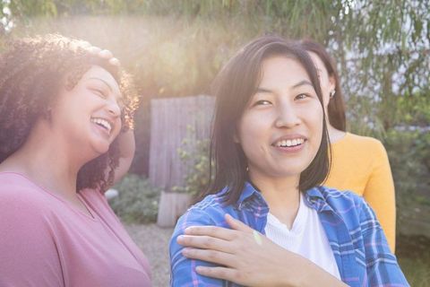 Diverse Women Bonding in Sunlit Backyard