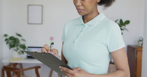 Focused African American Physiotherapist Taking Notes - Download Free Stock Images Pikwizard.com