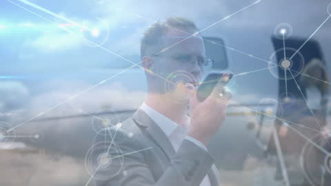 Businessman Utilizing Smartphone with Digital Connections Overlay