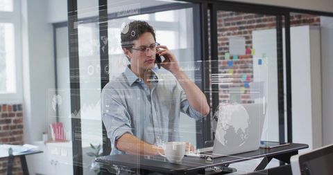 Businessman Analyzing Digital Data in Industrial Office