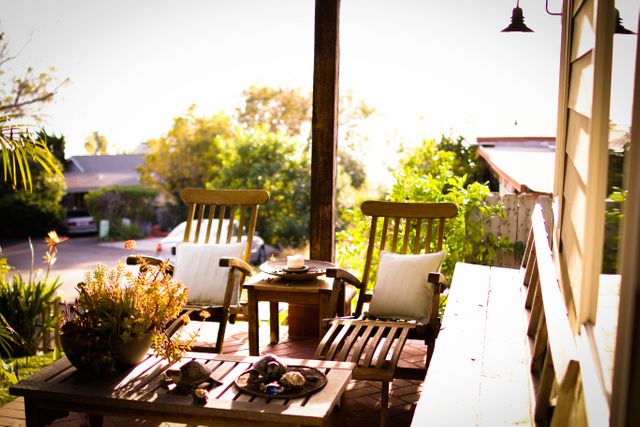 Cozy Outdoor Patio with Wooden Furniture at Sunrise - Download Free Stock Photos Pikwizard.com