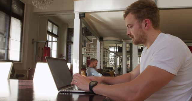 Man Working on Laptop in Modern Bright Office - Download Free Stock Images Pikwizard.com