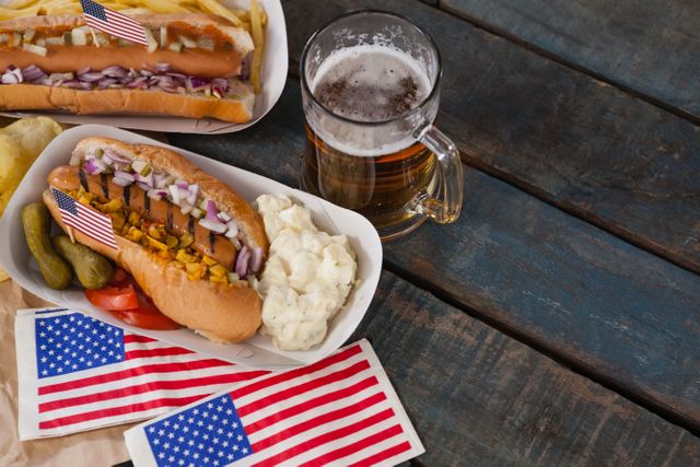 American Hot Dogs and Beer on Rustic Wooden Table - Download Free Stock Photos Pikwizard.com