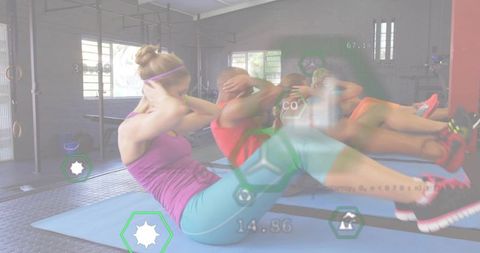 Group performing synchronized core workout on mats with futuristic hud fitness overlays