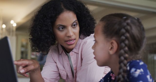 Mother Helping Daughter with Schoolwork at Home - Download Free Stock Images Pikwizard.com