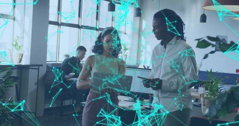 Digital Teamwork Amidst Office Tech Collaboration