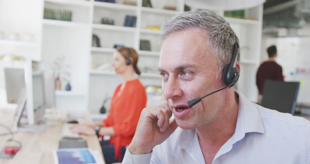 Customer service representatives working at modern office with headsets - Download Free Stock Images Pikwizard.com