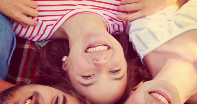 Friends Lying on Blanket Smiling Outdoors in Summer - Download Free Stock Images Pikwizard.com