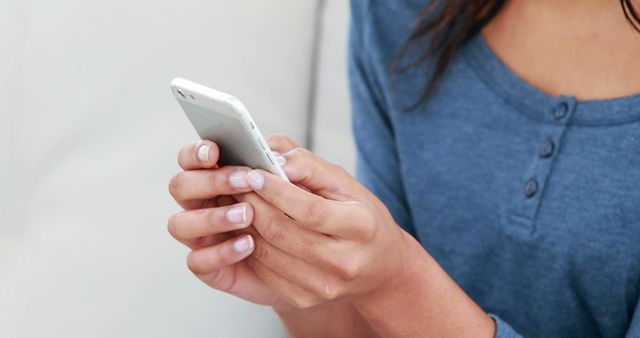 Woman Typing on Smartphone in Blue Shirt - Download Free Stock Images Pikwizard.com