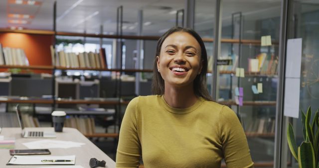 Smiling Young Professional Woman in Office Environment - Download Free Stock Images Pikwizard.com