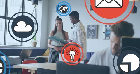 Diverse Coworkers Collaborating with Technological Icons Overlay