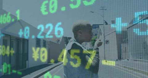 Woman walking outdoors as financial data is projected on screen