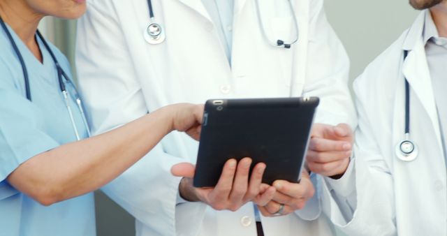 Medical Team Analyzing Patient Data on Tablet - Download Free Stock Images Pikwizard.com