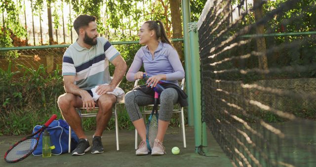 Image of happy caucasian couple on having break the court. Healthy active lifestyle and fitness at home.