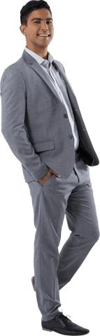 Confident Young Businessman Standing in Gray Suit with Hands in Pockets