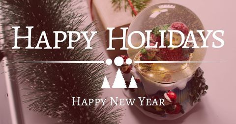 Festive Holiday Greeting with Snow Globe and Decorations