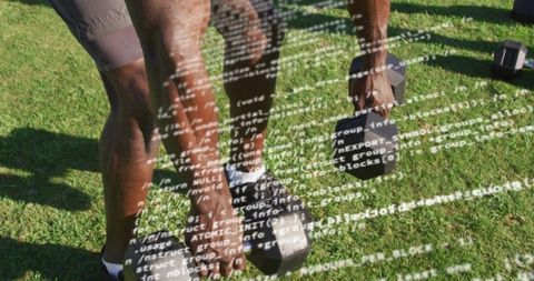 Mature man lifting hex dumbbells on grass with code overlay concept for tech fitness