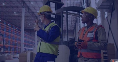 Warehouse workers pointing and inspecting inventory near forklift with scanner and radio
