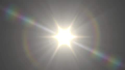 Bright Lens Flare with Colorful Light Trails on Dark Background