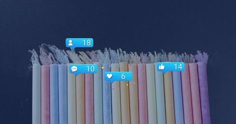 Colorful pastel chalk with digital icons enhancing creativity