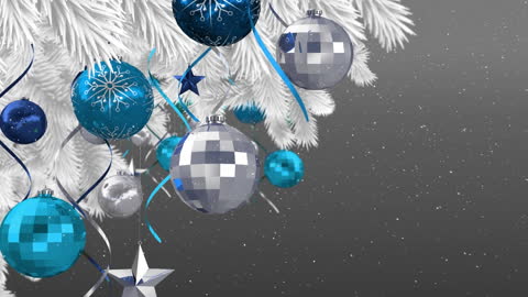 Festive Christmas Tree with Blue and Silver Baubles in Snowfall