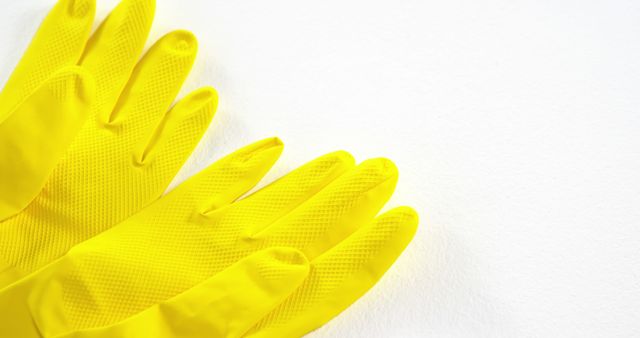 Close-up of Yellow Rubber Cleaning Gloves on White Background - Download Free Stock Images Pikwizard.com