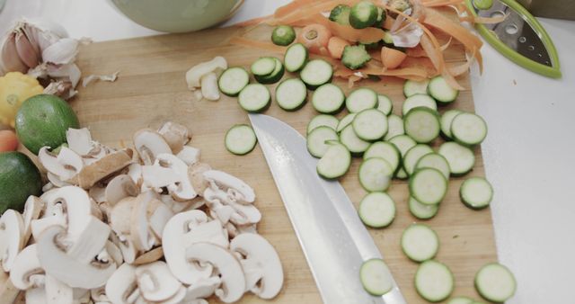 Chopped Mushrooms and Zucchini on Cutting Board in Kitchen - Download Free Stock Images Pikwizard.com