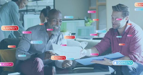 Diverse Team Analyzing Sales Report with Digital Notifications