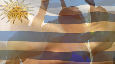 Waving Uruguay Flag Overlay on Beach Gathering