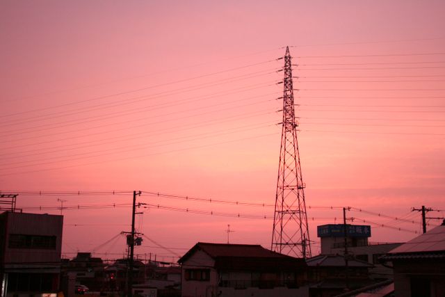 City Skyline with Transmission Tower during Pink Sunset - Download Free Stock Photos Pikwizard.com