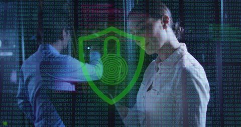 Cybersecurity Professionals Analyzing Data in Server Room