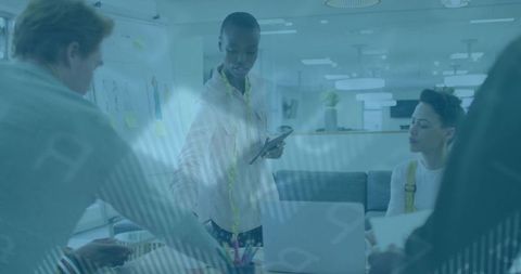 Fashion designer showcasing digital designs in collaborative studio