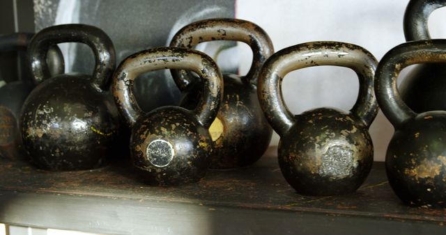 Aged Kettlebells on Rustic Shelf in Gym - Download Free Stock Images Pikwizard.com