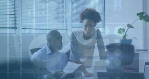 Diverse Professionals Analyzing Data Analytics in Corporate Office