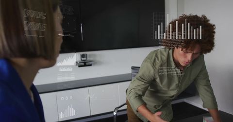 Diverse Team Analyzing Financial Data with Holographic Charts in Office