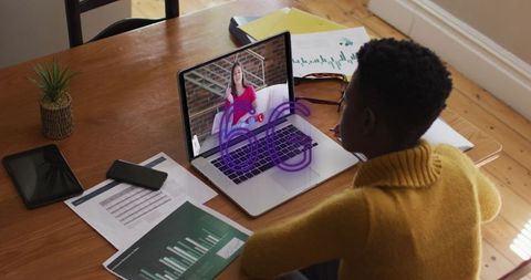 Young Professional Engaging in 6G Video Call Setup and Analytics Review