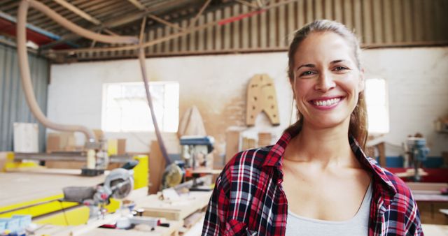 Smiling Woman in Woodworking Workshop with Tools - Download Free Stock Images Pikwizard.com