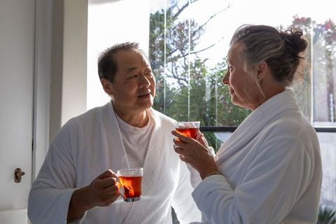 Senior Couple Enjoys Tea in Luxurious Spa Retreat