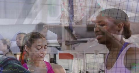 Women Exercising Together in Gym With Financial Data Overlay Blending Fitness and Finance