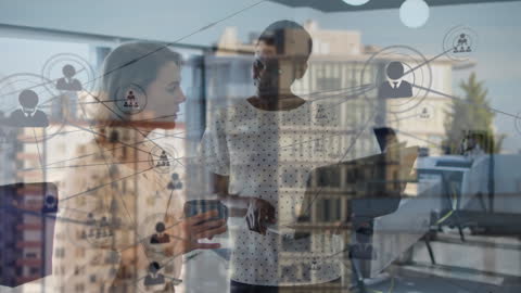 Colleagues Analyzing Digital Networks Over Cityscape