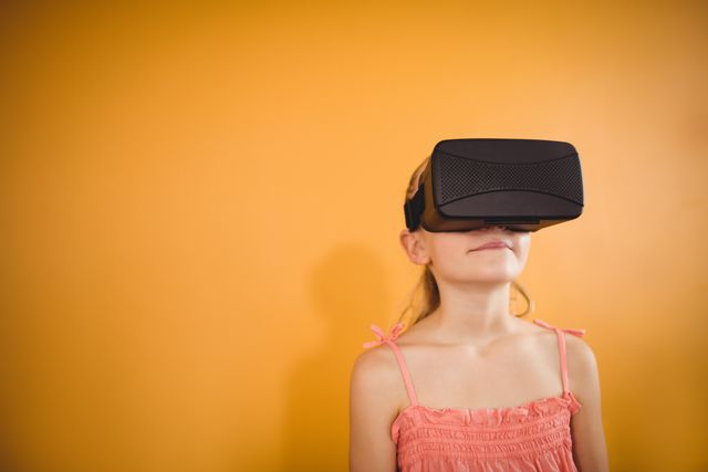 Girl using a virtual reality device - Download Free Stock Photos Pikwizard.com