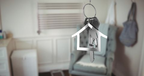 Silver House Key with Key Ring Over Home Interior Concept - Download Free Stock Images Pikwizard.com