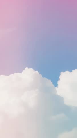Panning Vertical Cloudscape Showing Billowy Cumulus Clouds and Pastel Blue-to-Pink Sky