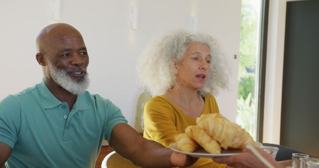 Happy senior diverse people having breakfast at retirement home - Download Free Stock Photos Pikwizard.com
