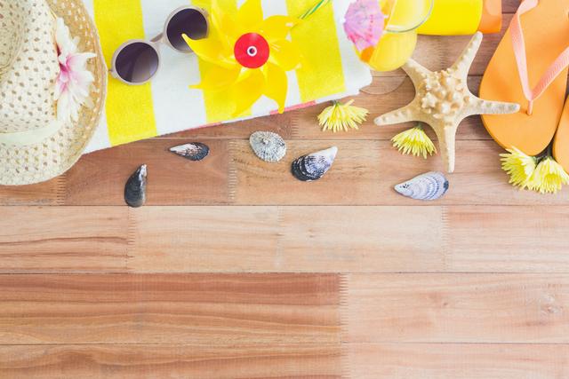 Various beach accessories on wooden board