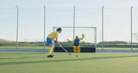 Female Field Hockey Players Engaging in Intense Practice Match